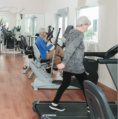 Seniors working out in the Fitness Center at Fellowship Square Phoenix Independent Living community